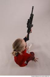 DENISA KNEELING POSE WITH GUN